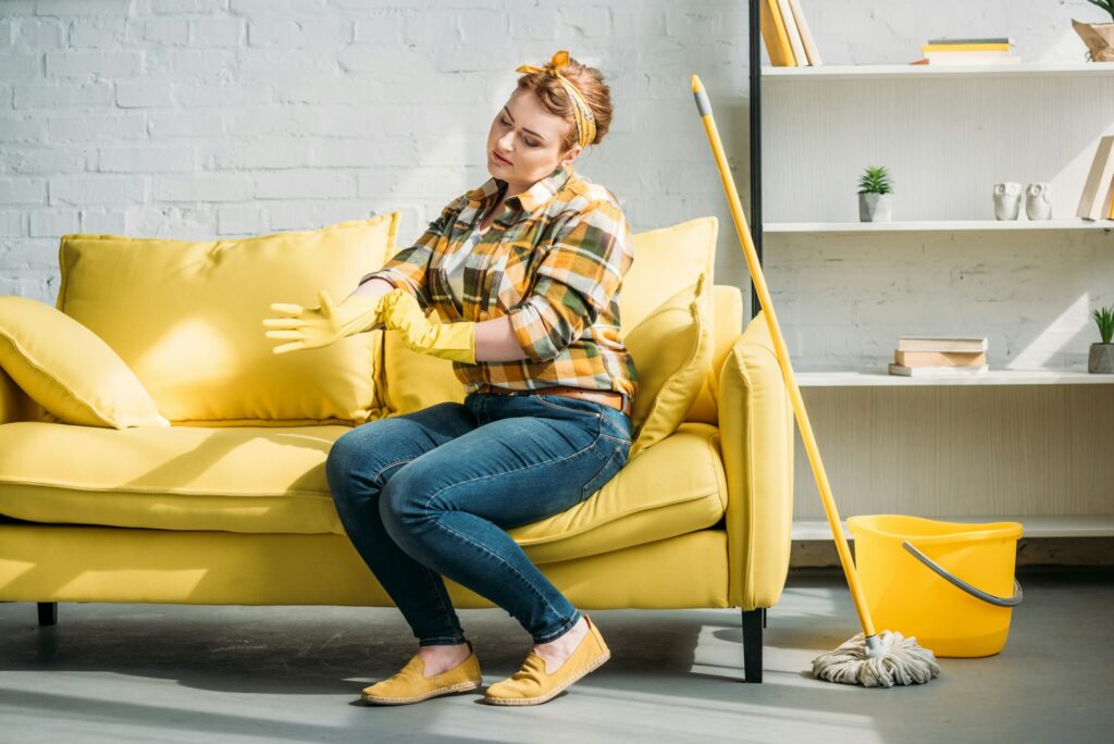 beautiful woman wearing rubber gloves for cleaning at home