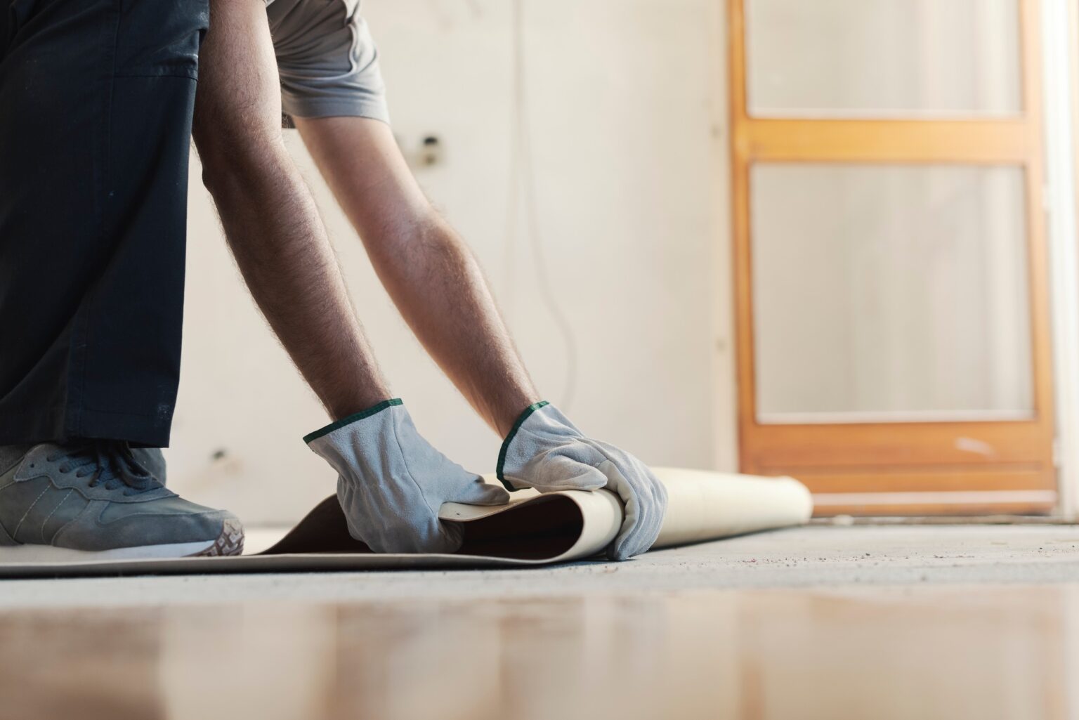 Contractor removing an old linoleum flooring